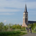 Cyclists on the dyke at Sint-Amands