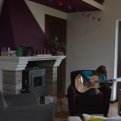 Kiri making good use of the lounge and resident guitar