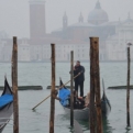 Gondola returning with island and mist behind