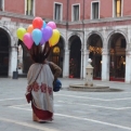 Lady with balloons tied to her hair