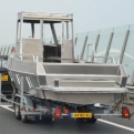 Trundling up the motorway, following... a boat?