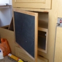 We replaced the oven with a cupboard and a blackboard for a door